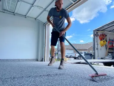 Maverick Concrete Coatings team member at work installing a concrete floor coating