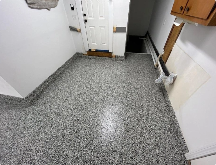 Finished basement floor with high-gloss polyaspartic concrete coating
