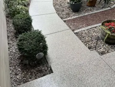 Concrete walkway sealed with durable polyaspartic coating