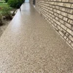 Outdoor patio with UV-stable decorative concrete coating