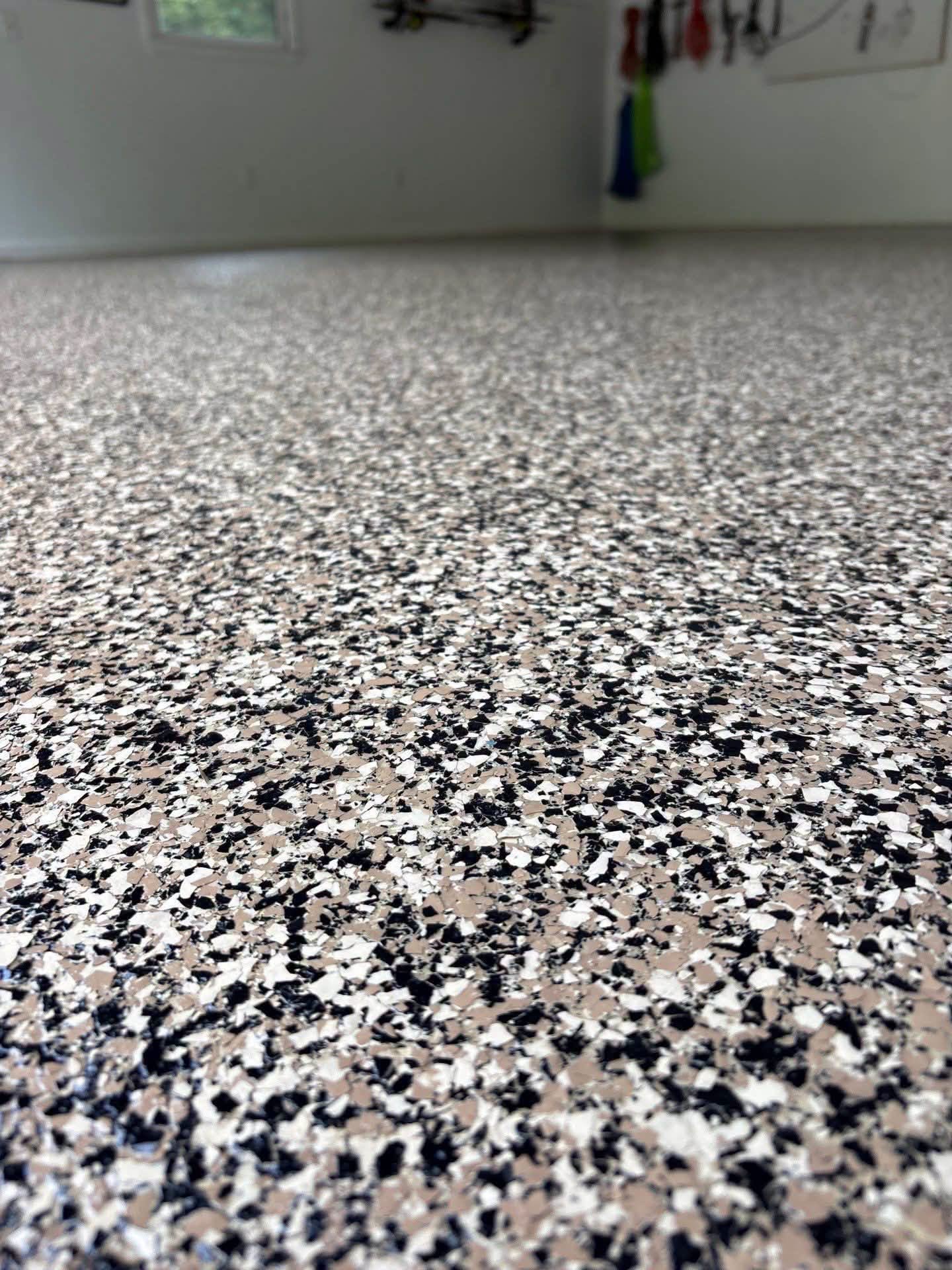 How Garage Floor Coatings Stand Up to Oil, Grease, and Automotive Chemicals