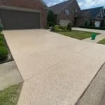 Residential driveway protected with high-traffic concrete coating