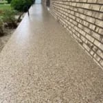 Outdoor patio with UV-stable decorative concrete coating
