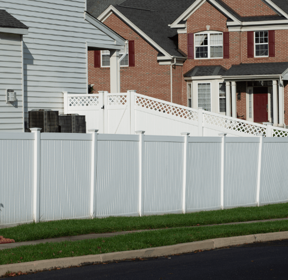 Custom white vinyl privacy fence with decorative lattice top